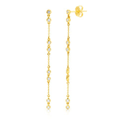 A pair of Stardust Earrings in yellow gold on a white background. 