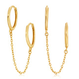 A pair of Double Huggie Earring with Chains on a white background. 