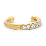 A Pavé Ear Cuff in yellow gold on a white background. 