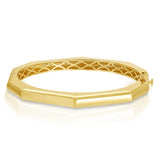 A yellow gold Tenfold Hinge Bangle on a white background. 