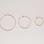 Sleek & Chic Hoops in small, medium and large against an off-white background.  