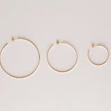 Sleek & Chic Hoops in small, medium and large against an off-white background.  