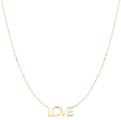 A LOVE Necklace in yellow gold on a cable chain on a white background. 