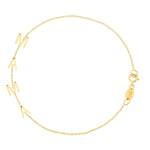 A Mama Bracelet in yellow gold on a white background. 