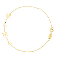 A Mama Bracelet in yellow gold on a white background. 