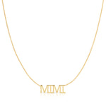 A MIMI Necklace in yellow gold on a cable chain on a white background.