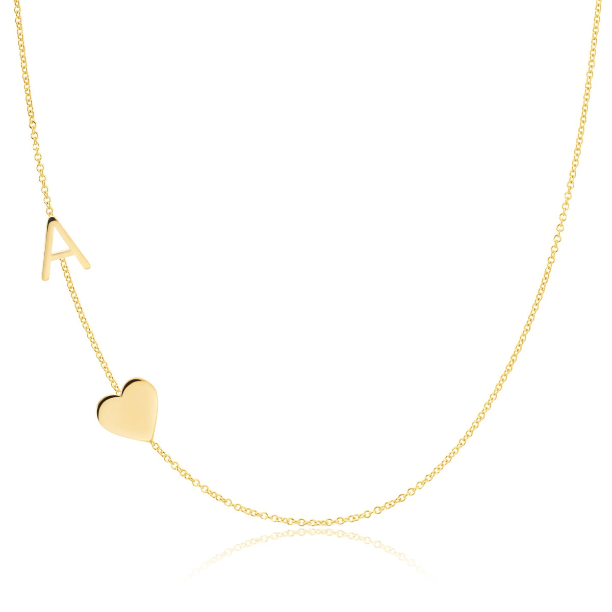 A Monogram Necklace with Heart Yellow Gold and a letter A charm on a white background.