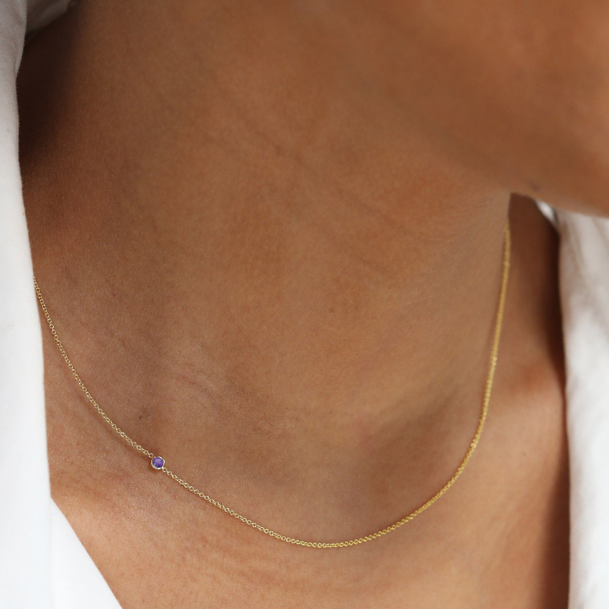 A yellow gold 14K Gold Asymmetrical Birthstone Necklace - Amethyst (February) on a white background. 