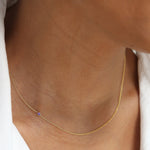 A yellow gold 14K Gold Asymmetrical Birthstone Necklace - Amethyst (February) on a white background. 