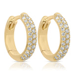 A pair of Pavé Huggies on a white background. 