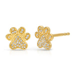 A pair of Pavé Charm Studs - Paw in yellow gold on a white background.