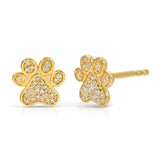 A pair of Pavé Charm Studs - Paw in yellow gold on a white background.