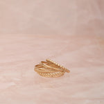 Delicate Trio Stacking Rings on a light pink marble background. 
