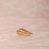 Delicate Trio Stacking Rings on a light pink marble background. 