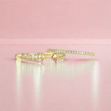 A Pavé Diamond Ring and Open Diamond Ring on a light pink background. 