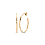 A Sleek & Chic Hoops - Small in yellow gold on a white background. 