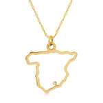 A Spain pendant necklace in yellow gold with a diamond on a white background.