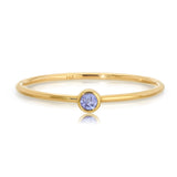 A Birthstone Ring in Tanzanite - December  on a white background. 