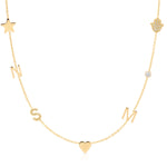 Gold necklace with various charms including a star, heart, and hand on a white background