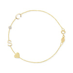 Gold bracelet with letter 'S', heart, and round charm on a white background