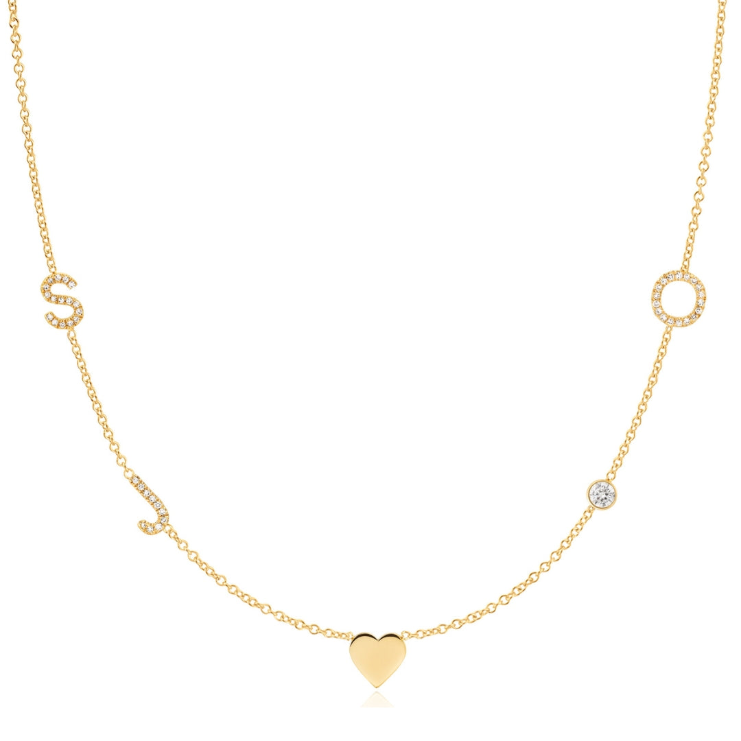 Gold necklace with a heart pendant on a white background