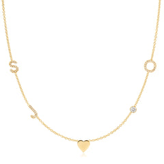 Gold necklace with a heart pendant on a white background