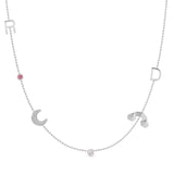 Necklace with various charms including a moon, rainbow, and letter 'R' on a white background