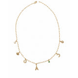 Gold necklace with various charms on a white background
