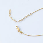 The back of a Stardust Diamond Necklace, showing the lobster clap on a white background. 