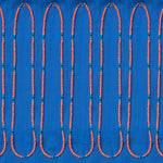 Several Endless Summer Necklaces - Calypso laid against a blue fabric background.