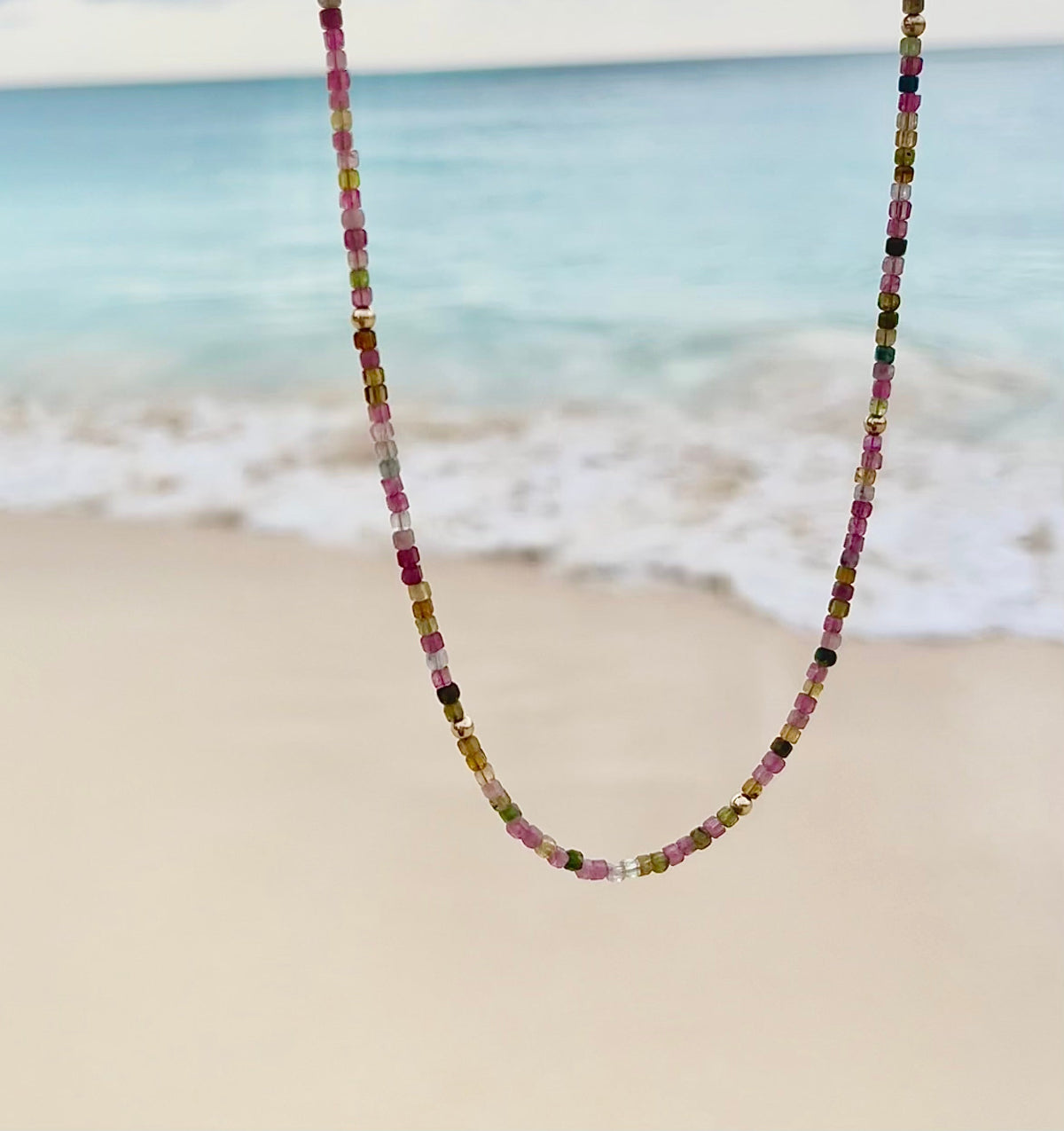 An Endless Summer Necklace - Coral Reef with the beach as a background. 