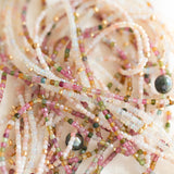 Close-up of several Endless Summer Necklaces (Coral Reef, Sweet Escape and 
Pink Sands) intertwined.