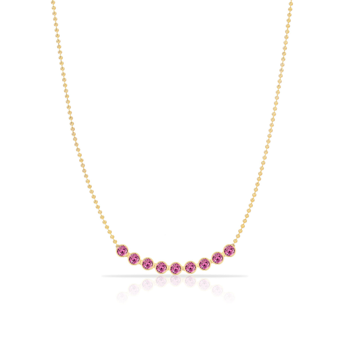 A Birthstone Arc Layering Necklace – Yellow Gold in Pink Tourmaline – October on a white background.