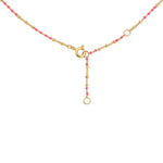 The back of a Confetti Necklace - Pink on a white background. 