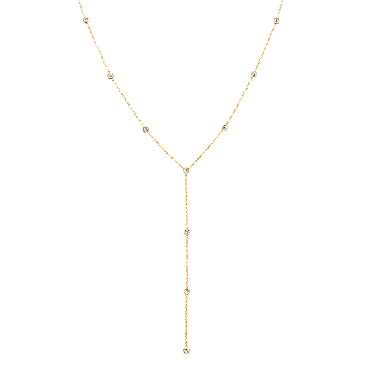 A Starstruck Diamond Lariat in yellow gold on a white background. 