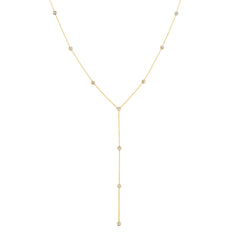 A Starstruck Diamond Lariat in yellow gold on a white background. 