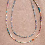Endless Summer Necklaces - Capri and Blue Lagoon against a neutral fabric background. 
