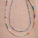 Endless Summer Necklaces - Capri and Blue Lagoon against a neutral fabric background. 
