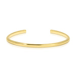 A gold vermeil Rendezvous Cuff on a white background. 
