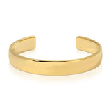 A gold vermeil All in Cuff on a white background. 