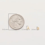 A silver coin with measurements shown with a Petite Letter Charm a and a Gold Letter Charm A on a white background. 