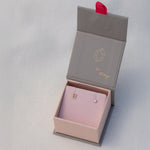 A Pavé Monogram Earring Set in the letter B in a Maya Brenner jewellery box against a light grey background. 