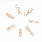 Pavé pendants MUM, LOVE, GAGA, NANA, MAMA, MRS and MOM on a white background. 