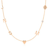 A Custom Gold Necklace in rose gold with seven charms, pavé letters J and S, letters N and M, a heart, a birthstone and a pavé hand, on a white background.