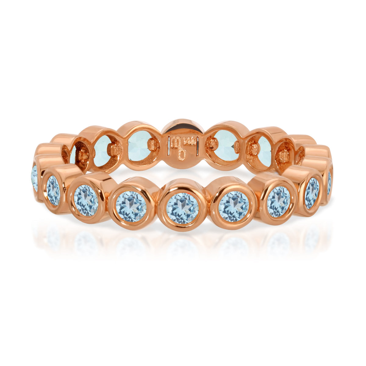 The Forget Me Not Bouquet Ring in rose gold on a white background. 