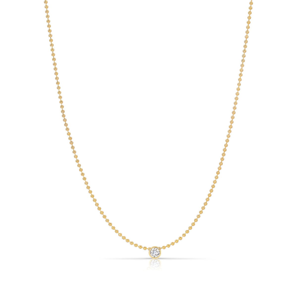A Single Birthstone Layering Necklace - Yellow Gold in Diamond - April on a white background.