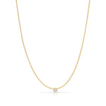 A Single Birthstone Layering Necklace - Yellow Gold in Diamond - April on a white background.