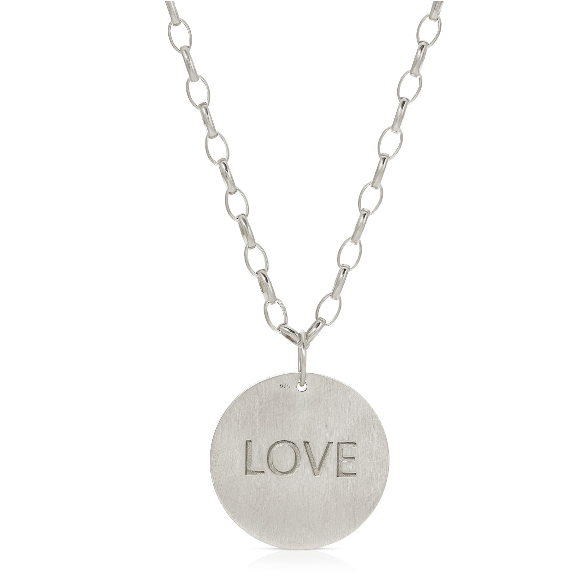 The back of a Virtues Pendant - Circle in sterling silver with 'LOVE' engraved on a white background. 