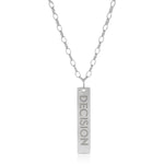 The back of a Virtues Pendant - Rectangle in sterling silver with 'DECISION' engraved on a white background. 