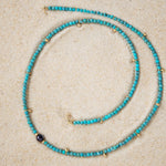 An Endless Summer Necklace - Santorini laid on sand. 